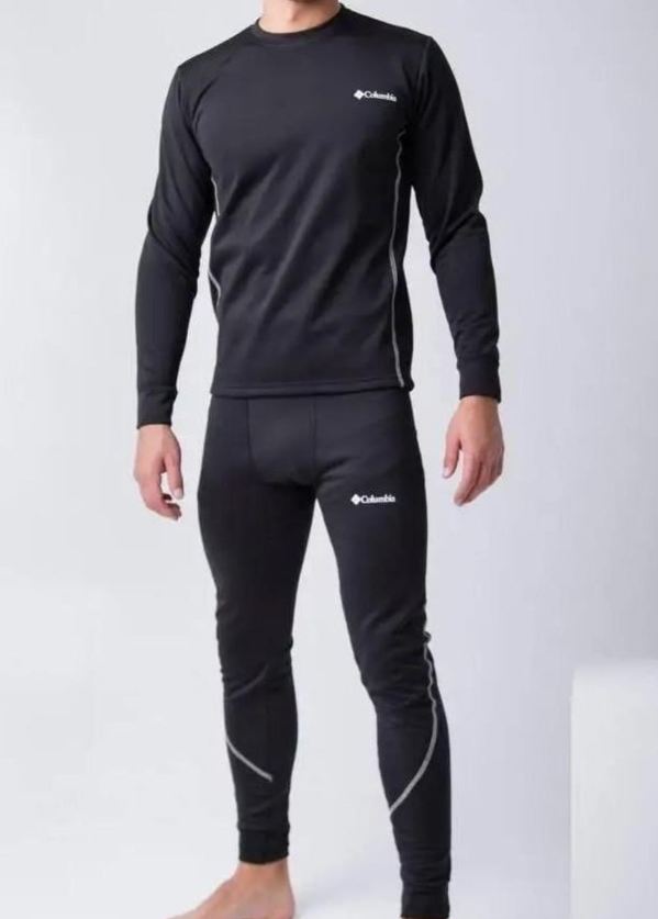 Пальто сірого кольору із хутровим коміром